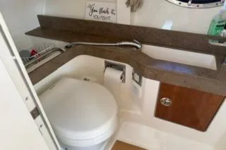 Slide: The Image of Twin engines of a 2015 Formula 350 Crossover Bowrider, showcasing powerful marine engineering. - 32