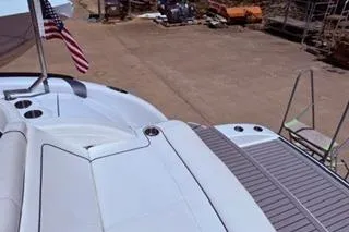 Slide: The Image of 2015 Formula 350 Crossover Bowrider on stands, sleek design, outdoors. - 39