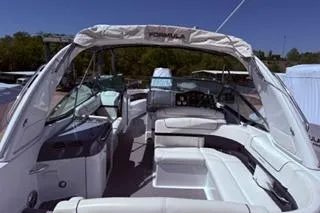 Slide: The Image of 2015 Formula 350 Crossover Bowrider boat with reflective hull and registration number. - 41