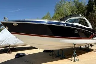 Slide: The Image of 2015 Formula 350 Crossover Bowrider boat on stands, showing dual outboard motors. - 44