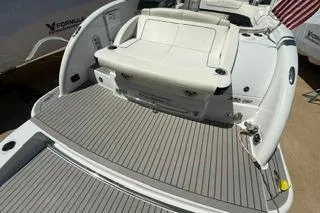 Slide: The Image of 2015 Formula 350 Crossover Bowrider boat with spacious deck and seating area. - 6