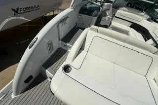 Slide: The Image of 2015 Formula 350 Crossover Bowrider, spacious seating, sleek design, luxury boat interior. - 8