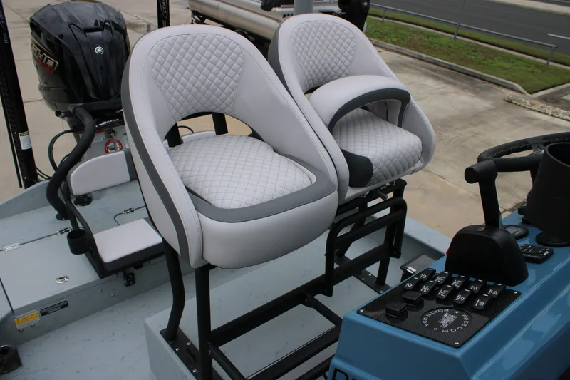 Slide: The Image of Luxury seating and controls on 2026 Freedom Boats 24 Defender. - 18