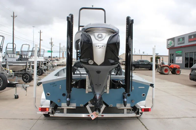 Slide: The Image of 2026 Freedom Boats 24 Defender with Yamaha engine, displayed at a dealership. - 4