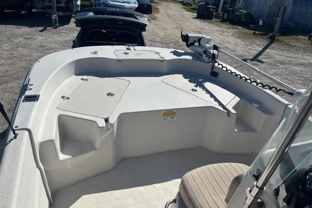 Slide: The Image of 2015 Carolina Skiff 198 DLV boat deck with seating and storage compartments. - 16