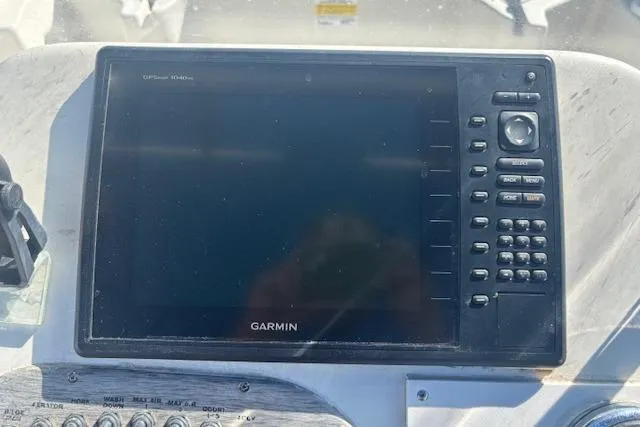 Slide: The Image of Garmin GPS device on 2015 Carolina Skiff 198 DLV boat dashboard. - 18
