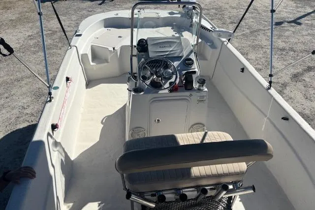 Slide: The Image of 2015 Carolina Skiff 198 DLV boat interior with steering console and seating. - 9