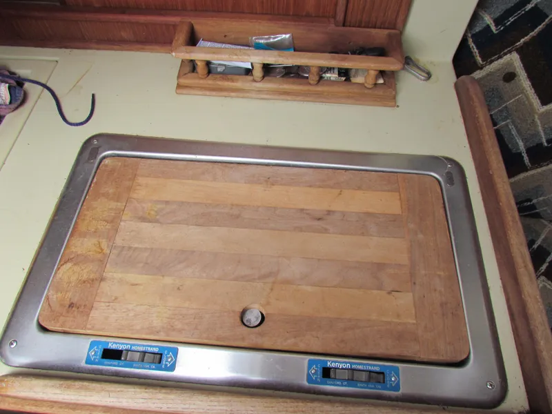 Slide: The Image of Wooden cutting board on Ericson 25 sailboat kitchen counter, 1982 model. - 11