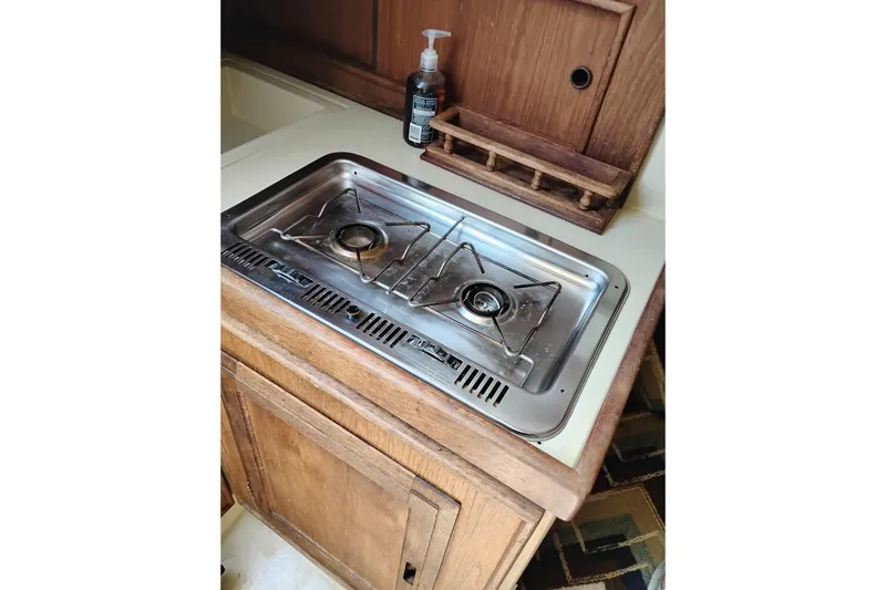 Slide: The Image of Compact kitchen stove in 1982 Ericson 25 sailboat galley. - 12