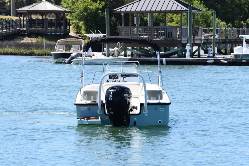 Slide: The Image of 2022 Boston Whaler 190 Montauk boat on water near dock and gazebo. - 5