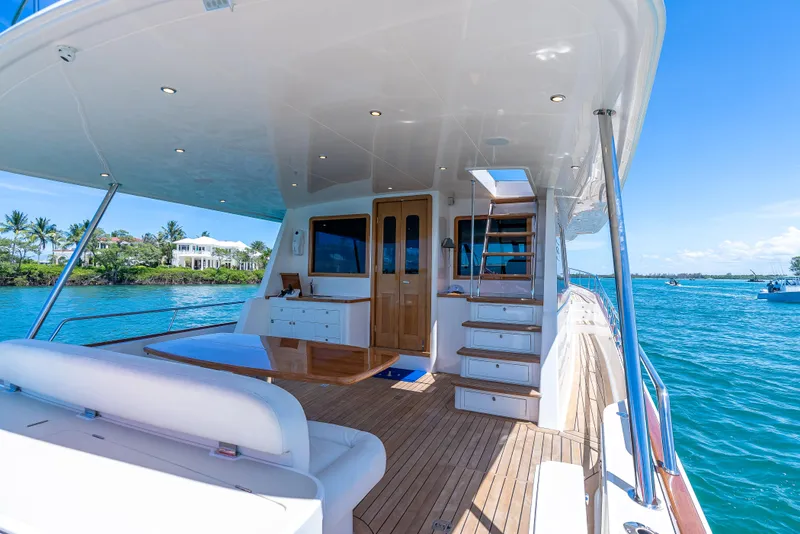Slide: The Image of Luxurious 2018 Grand Banks GB60 yacht deck with elegant seating and ocean view. - 14