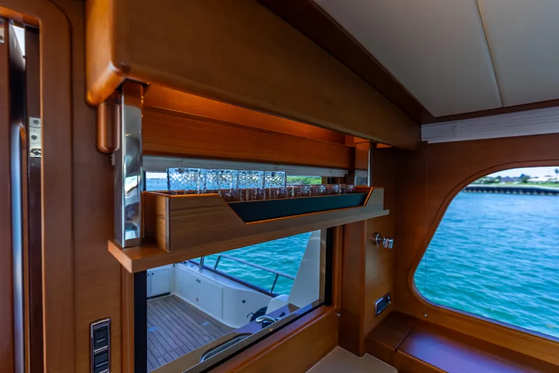 Slide: The Image of Luxurious interior of 2018 Grand Banks GB60 yacht with elegant wood finish and ocean view. - 24