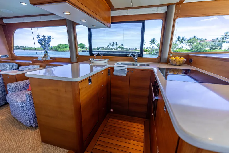 Slide: The Image of Luxurious 2018 Grand Banks GB60 yacht interior with modern kitchen and scenic ocean view. - 40