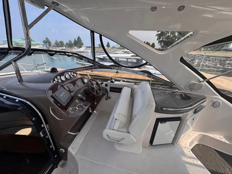 Slide: The Image of The cockpit of a 2006 Regal Commodore 3860 with white seating and a control console. - 6
