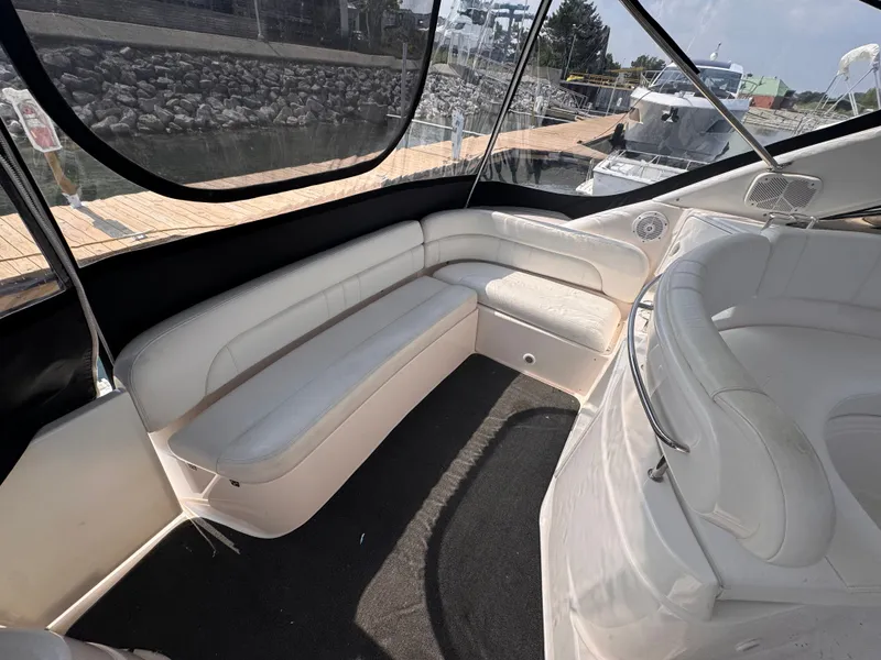Slide: The Image of The image shows the cockpit of a 2006 Regal Commodore 3860 with white leather seating. - 3