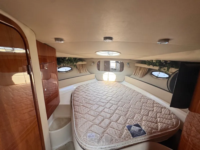 Slide: The Image of The cabin of the 2006 Regal Commodore 3860 features a large bed and a skylight. - 20