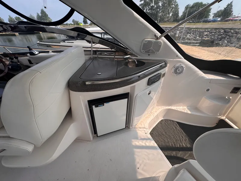 Slide: The Image of Interior of a 2006 Regal Commodore 3860 with a fridge and sink. - 11