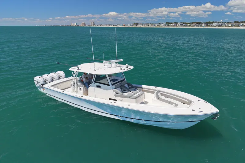 The Image of 2023 Regulator 41 boat on open sea, clear blue water. - 0