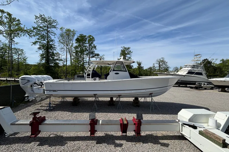 Slide: The Image of 2023 Regulator 41 boat on display in a marina with clear skies. - 10
