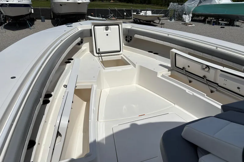 Slide: The Image of 2023 Regulator 41 boat interior with open storage compartments and seating. - 21