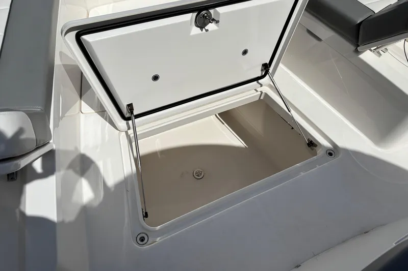 Slide: The Image of Open storage compartment on 2023 Regulator 41 boat, showcasing spacious interior design. - 23