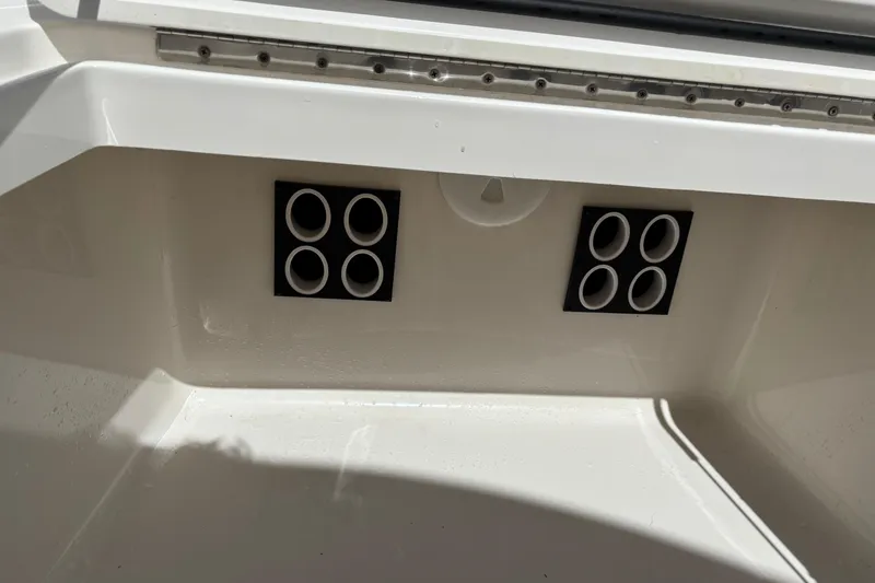 Slide: The Image of 2023 Regulator 41 boat interior detail with circular vents and sleek white finish. - 24