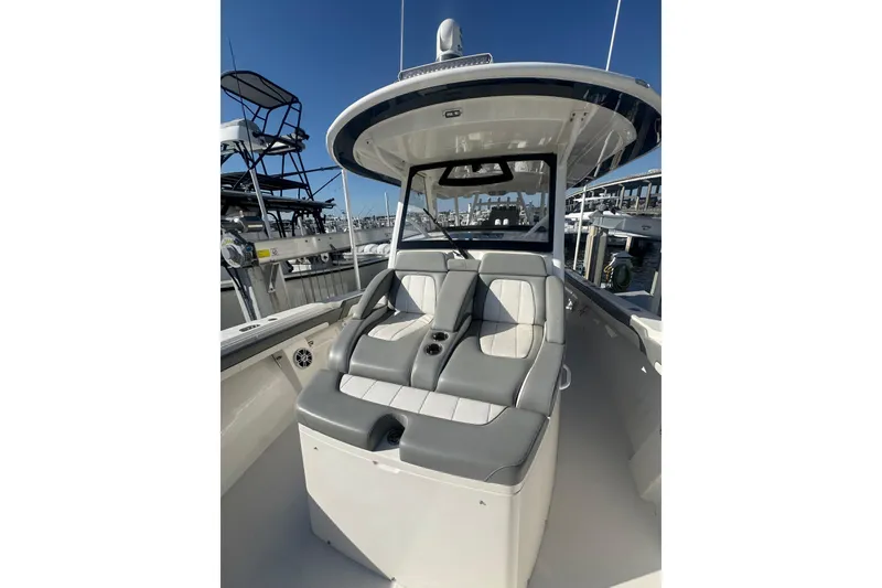 Slide: The Image of 2023 Regulator 41 boat interior with cushioned seating and helm station. - 27