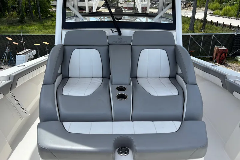 Slide: The Image of 2023 Regulator 41 boat with dual gray and white cushioned seats. - 28