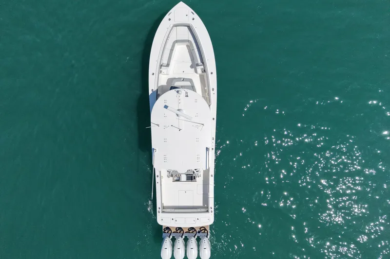 Slide: The Image of Aerial view of 2023 Regulator 41 boat on clear blue water. - 3