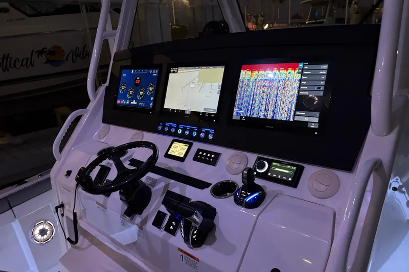 Slide: The Image of 2023 Regulator 41 boat dashboard with advanced navigation and control systems. - 41