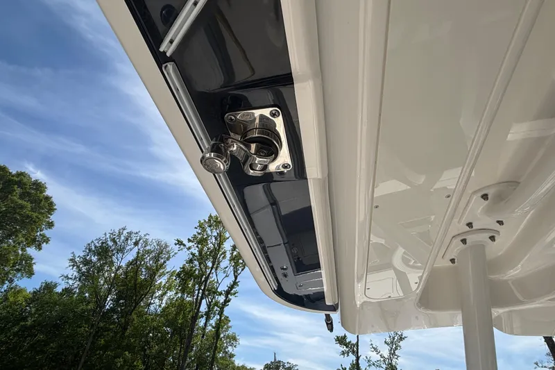 Slide: The Image of 2023 Regulator 41 boat detail, showcasing sleek design and polished metal fittings under a clear sky. - 46