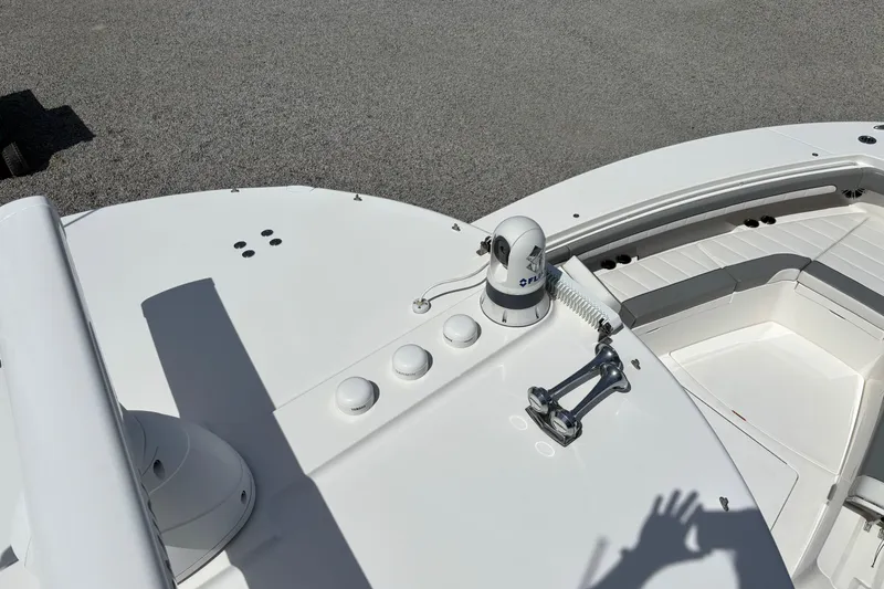 Slide: The Image of 2023 Regulator 41 boat deck with seating and equipment in sunlight. - 52