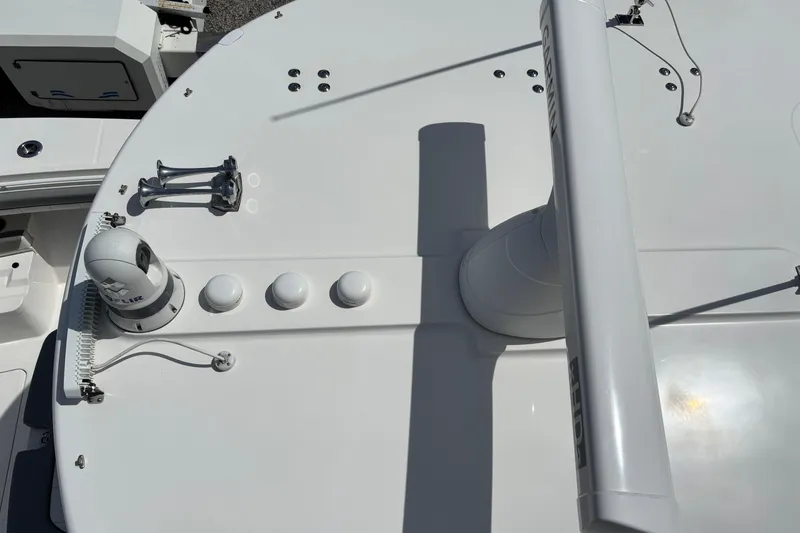 Slide: The Image of 2023 Regulator 41 boat deck with radar and navigation equipment. - 54