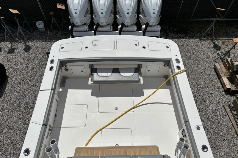 Slide: The Image of 2023 Regulator 41 boat deck with quad V8 engines, viewed from above. - 55