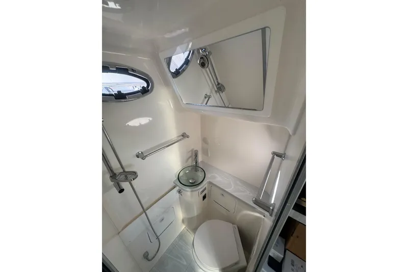 Slide: The Image of Luxurious bathroom interior of 2023 Regulator 41 boat, featuring modern fixtures and sleek design. - 59