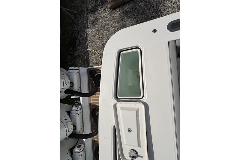 Slide: The Image of 2023 Regulator 41 boat deck with engine and storage compartment. - 61