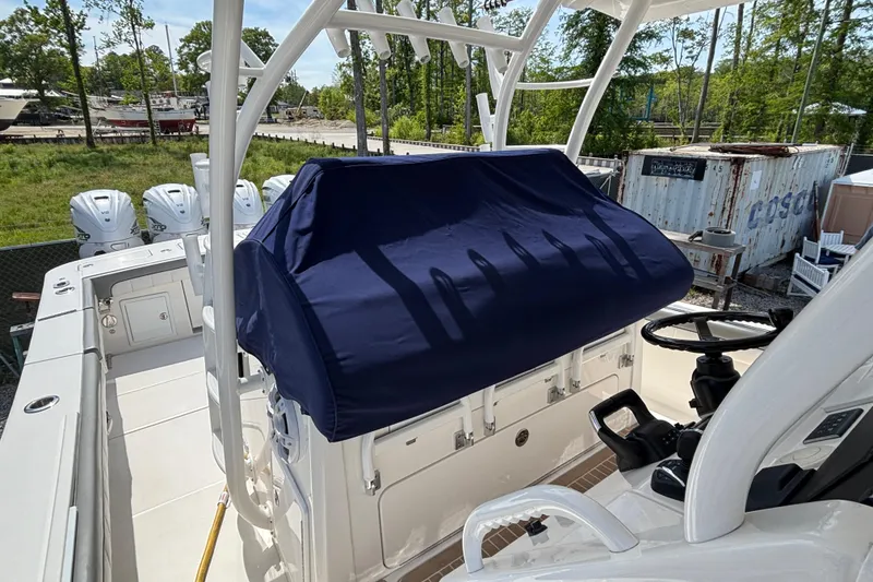 Slide: The Image of 2023 Regulator 41 boat with covered console and multiple outboard engines. - 65