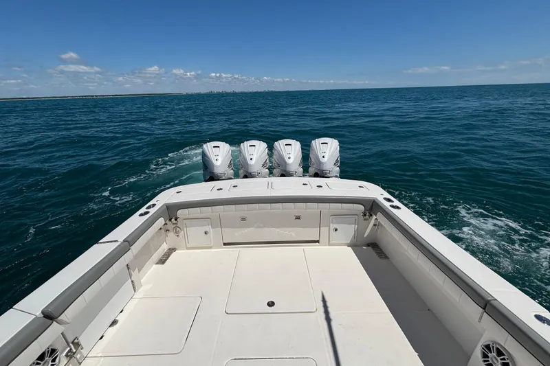 Slide: The Image of 2023 Regulator 41 boat with four engines cruising on open sea. - 75