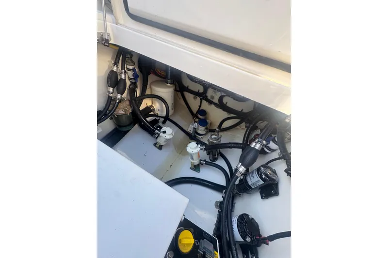 Slide: The Image of Engine compartment of 2023 Regulator 41 boat, showcasing hoses and mechanical components. - 78