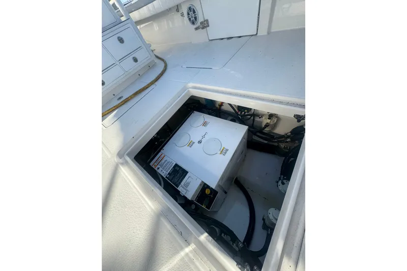 Slide: The Image of 2023 Regulator 41 boat engine compartment with visible machinery and wiring. - 79