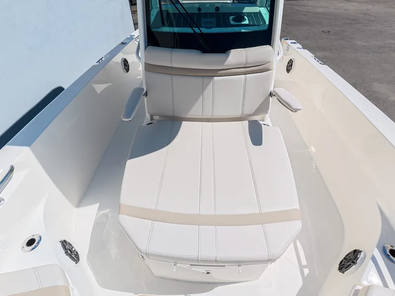 Slide: The Image of The 2027 Boston Whaler 280 Dauntless features a spacious, cushioned lounging area at the bow. - 20