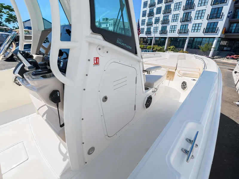 Slide: The Image of The image shows the cockpit of a 2027 Boston Whaler 280 Dauntless with modern controls. - 16