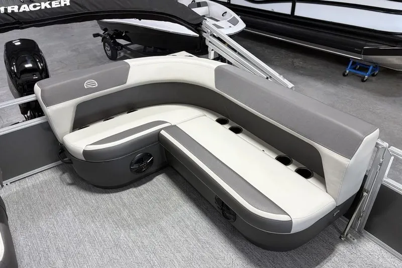 Slide: The Image of 2026 Sun Tracker Bass Buggy 16 XL Select boat interior with gray and white seating. - 12