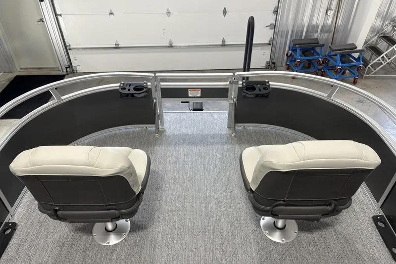 Slide: The Image of 2026 Sun Tracker Bass Buggy 16 XL Select interior with two swivel seats and cup holders. - 8