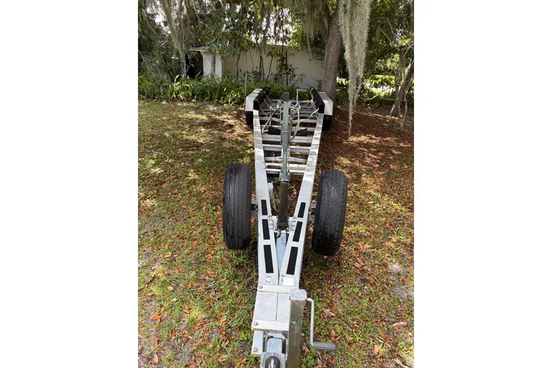 Slide: The Image of 1995 Grady-White Marlin 300 boat cockpit with steering wheel and captain's chair. - 11