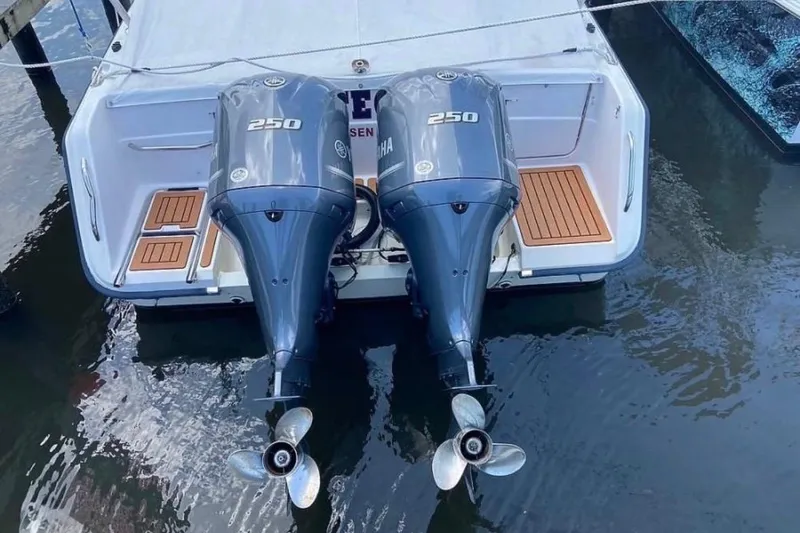 Slide: The Image of 1995 Grady-White Marlin 300 boat interior with wooden deck and steering area. - 6