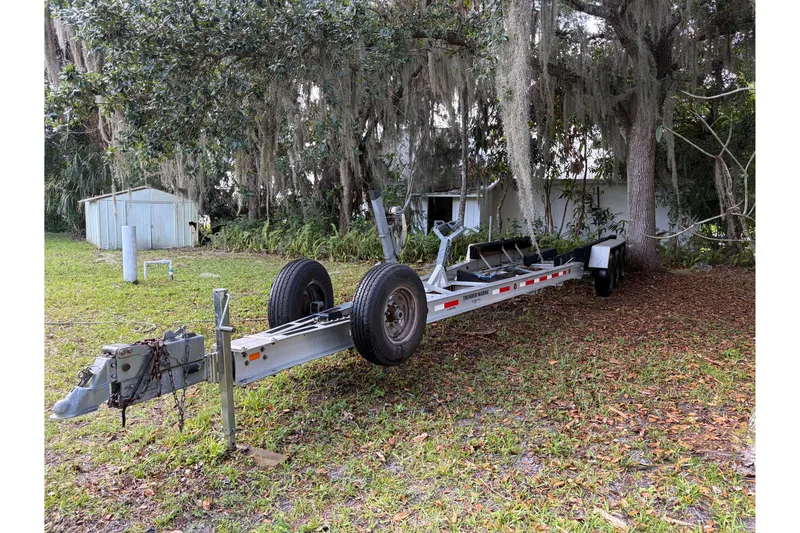 Slide: The Image of 1995 Grady-White Marlin 300 boat interior with helm chairs and teak flooring. - 9