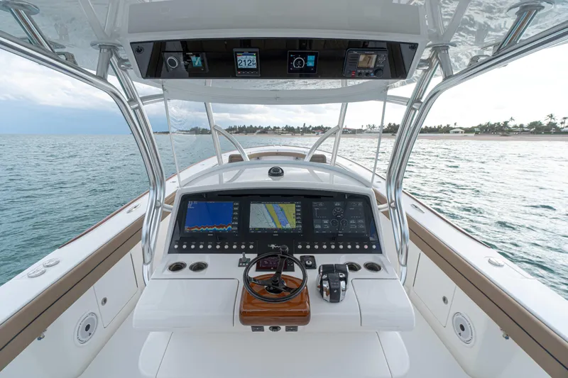Slide: The Image of 2026 Valhalla Boatworks V-41 helm with advanced navigation displays on open water. - 3