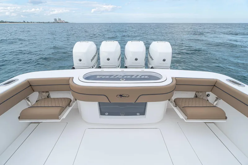 Slide: The Image of 2026 Valhalla Boatworks V-41 with quad Mercury engines, featuring spacious seating and ocean backdrop. - 7