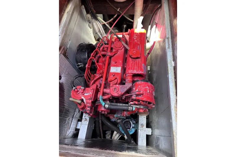 Slide: The Image of Red 1970 Chen engine in a metallic compartment, showcasing intricate wiring and components. - 14